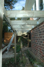 Firm fixing into the house wall is essential for a raised deck of any kind
